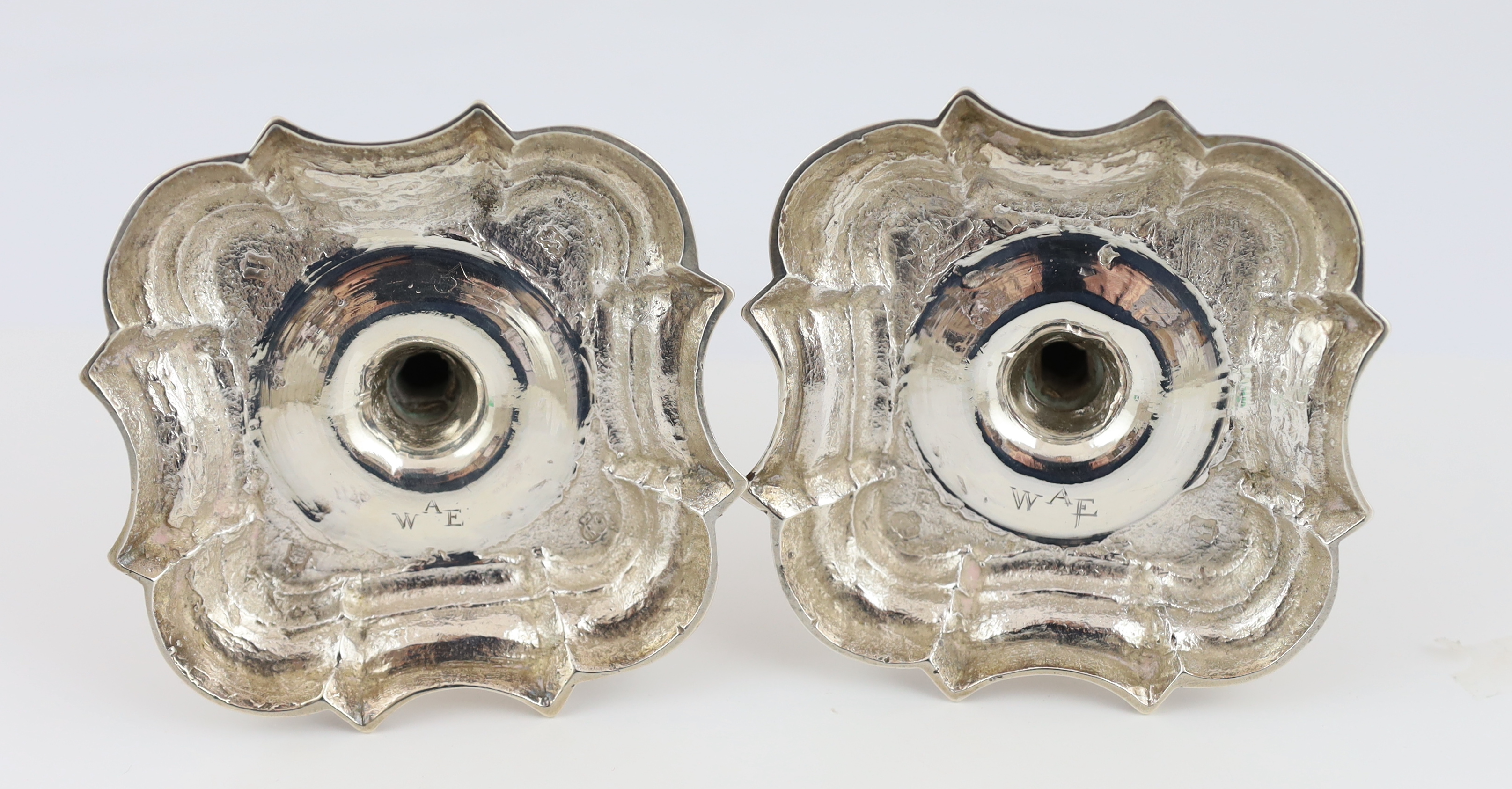 A pair of George II cast silver candlesticks, by Richard Gosling